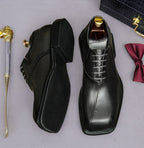 Men's chunky lug-sole wingtip brogue oxfords, black, side view with lace-up.