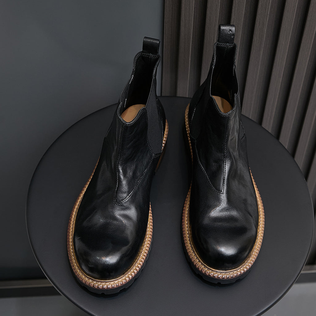 Men's pointed-toe suede Chelsea dress boots, black, back view showing heel and elastic panels