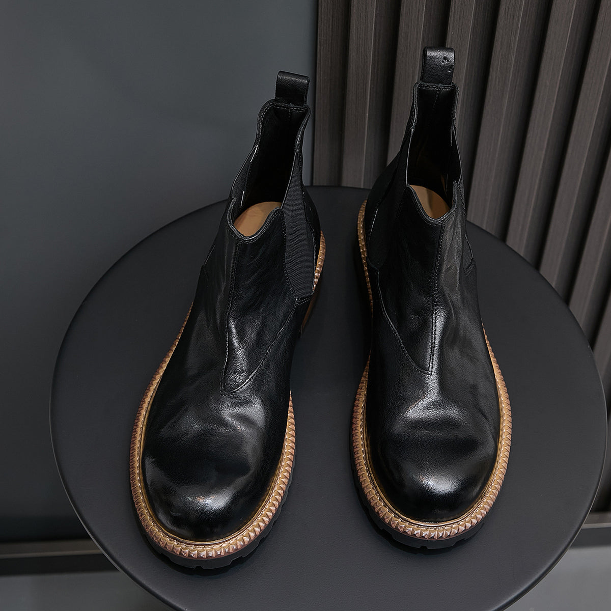 Men's pointed-toe suede Chelsea dress boots, black, back view showing heel and elastic panels