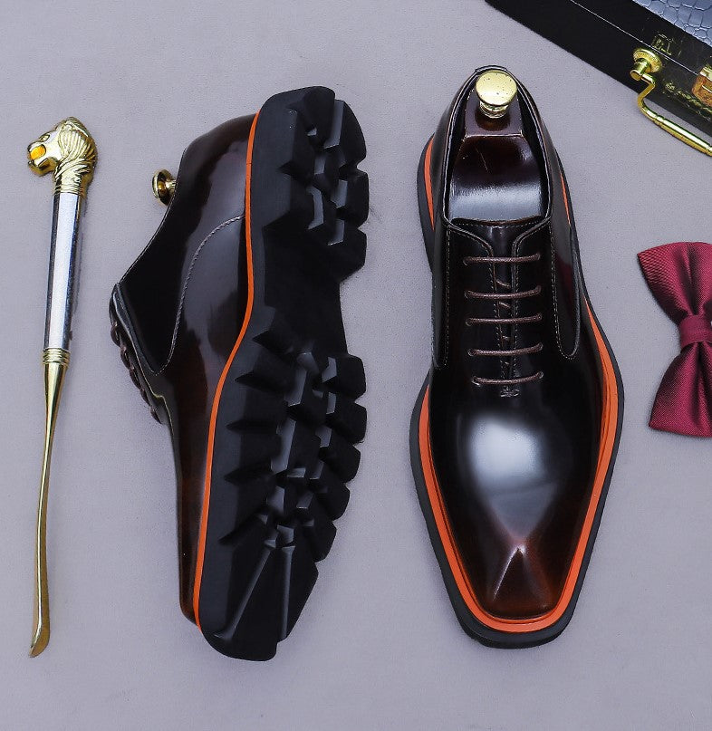 Men's black wingtip brogue oxford shoes, side view with chunky lug sole