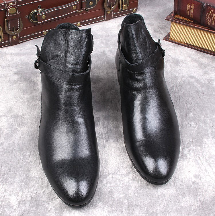 Black leather pointed-toe ankle boots with side buckle strap and low block heel.