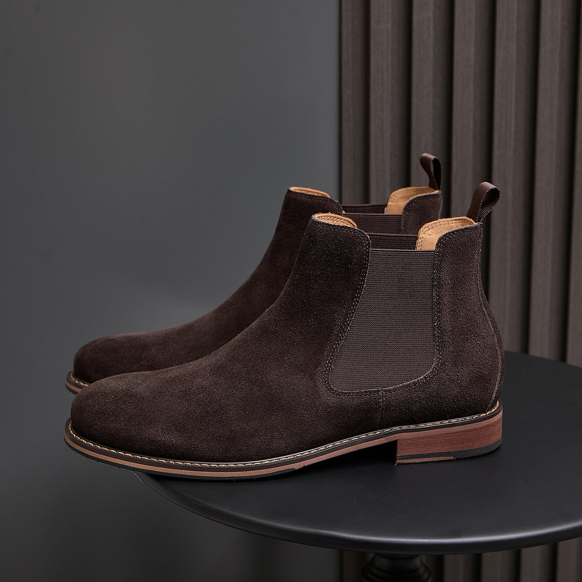 Dark brown suede Chelsea dress boot with elastic side gore and tan welt sole