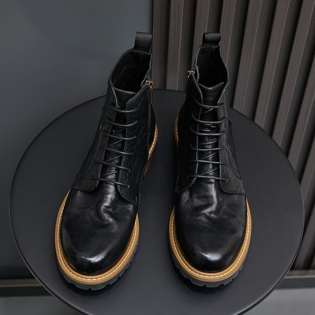 Pair of men's black leather ankle boots with pointed toe, lace-up, and side zip.