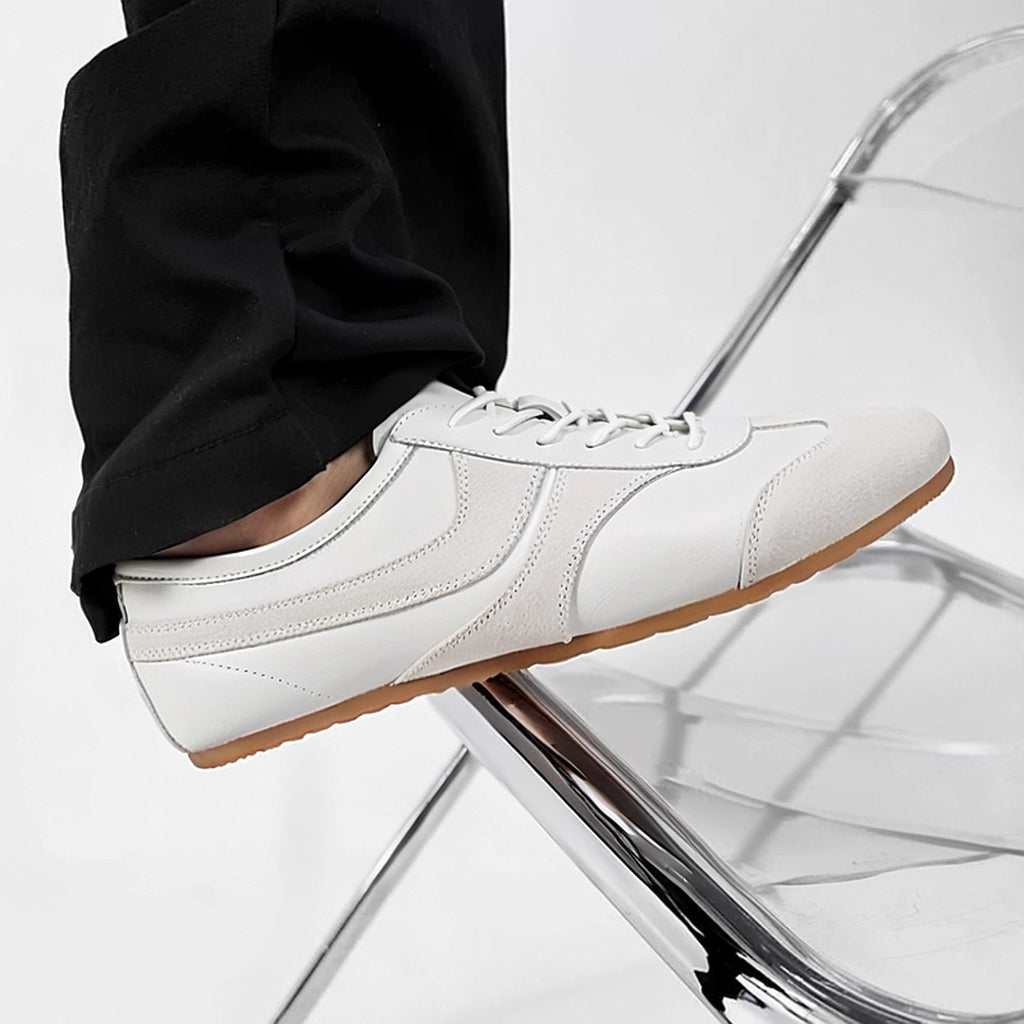 Men's white leather sneakers with lace-up front and smooth leather upper