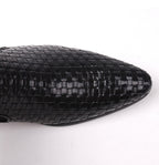 Black leather boot toe with woven braid pattern and pointed shape