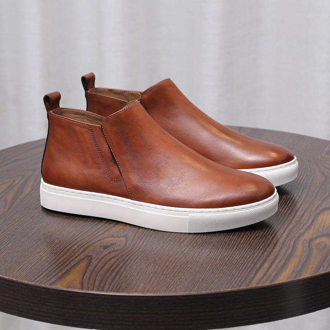 Brown leather pointed-cap toe side-zip dress boots with white rubber sole