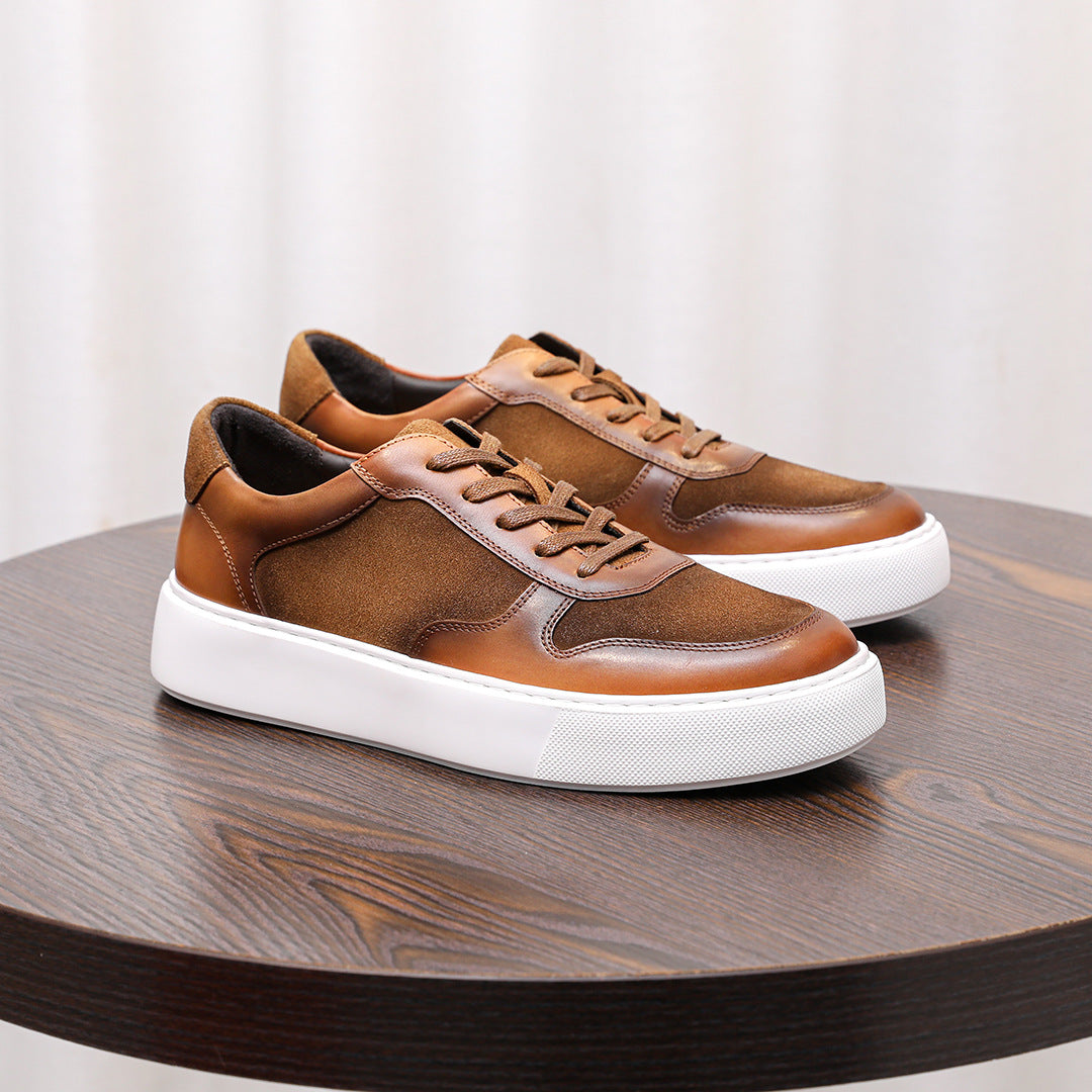 Brown minimalist leather sneakers with lace-up front and thick white platform sole