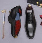 Black wingtip brogue oxford shoes, lace-up, showing red interior lining