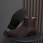 Men's pointed-toe suede Chelsea dress boots, dark brown, side view with outsole