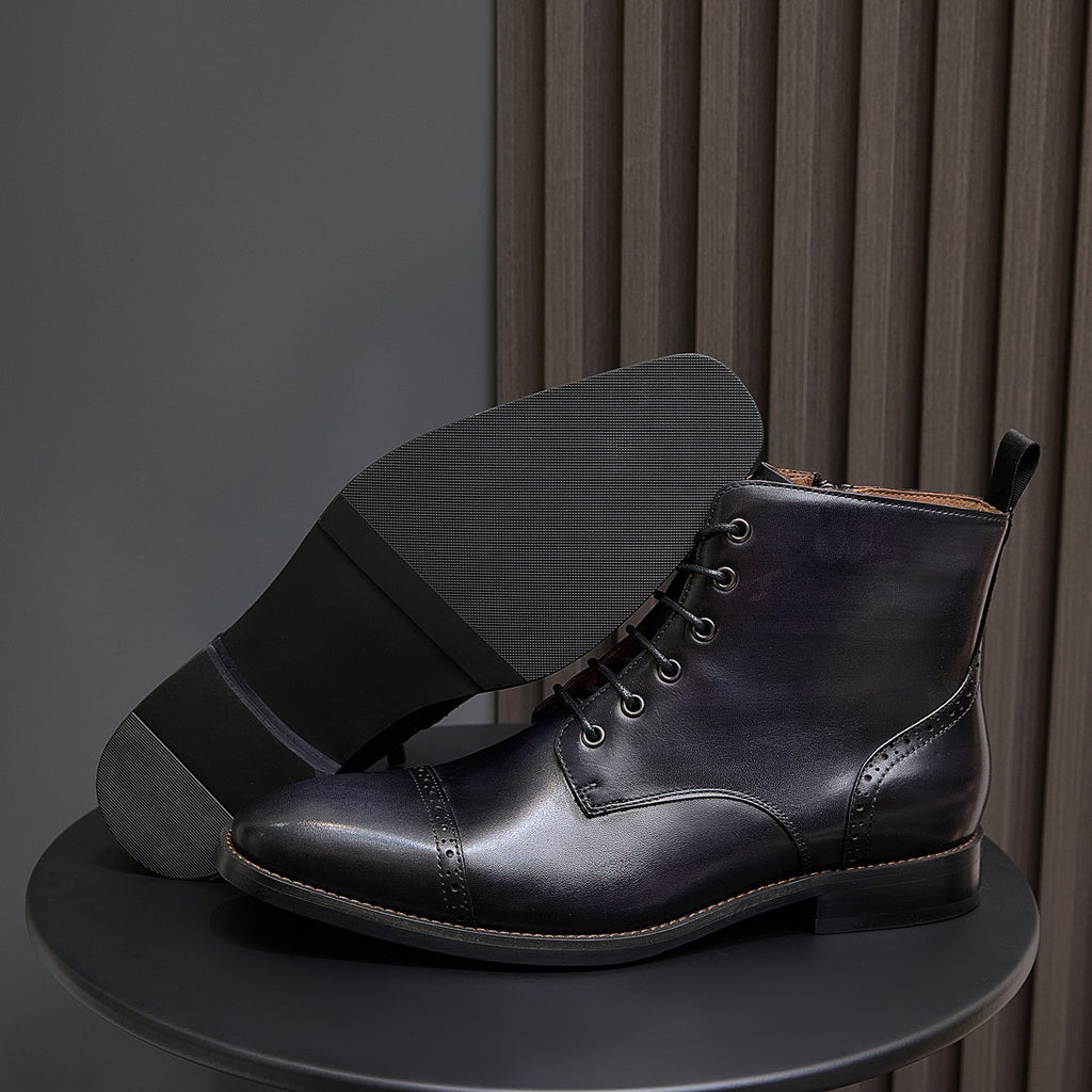 Men's dark leather lace-up ankle boot with thick sole and side pull tab
