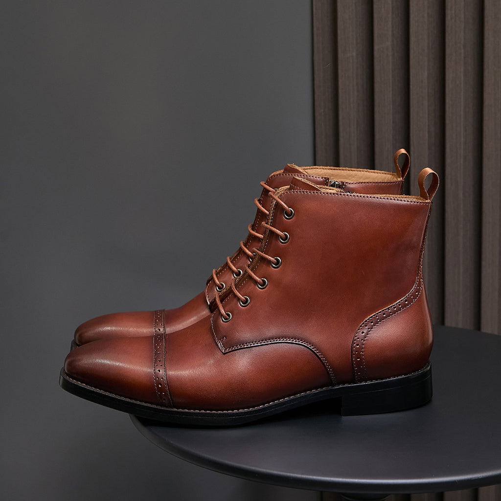 Men's brown leather pointed-toe lace-up dress boots with side zip and stitched paneling