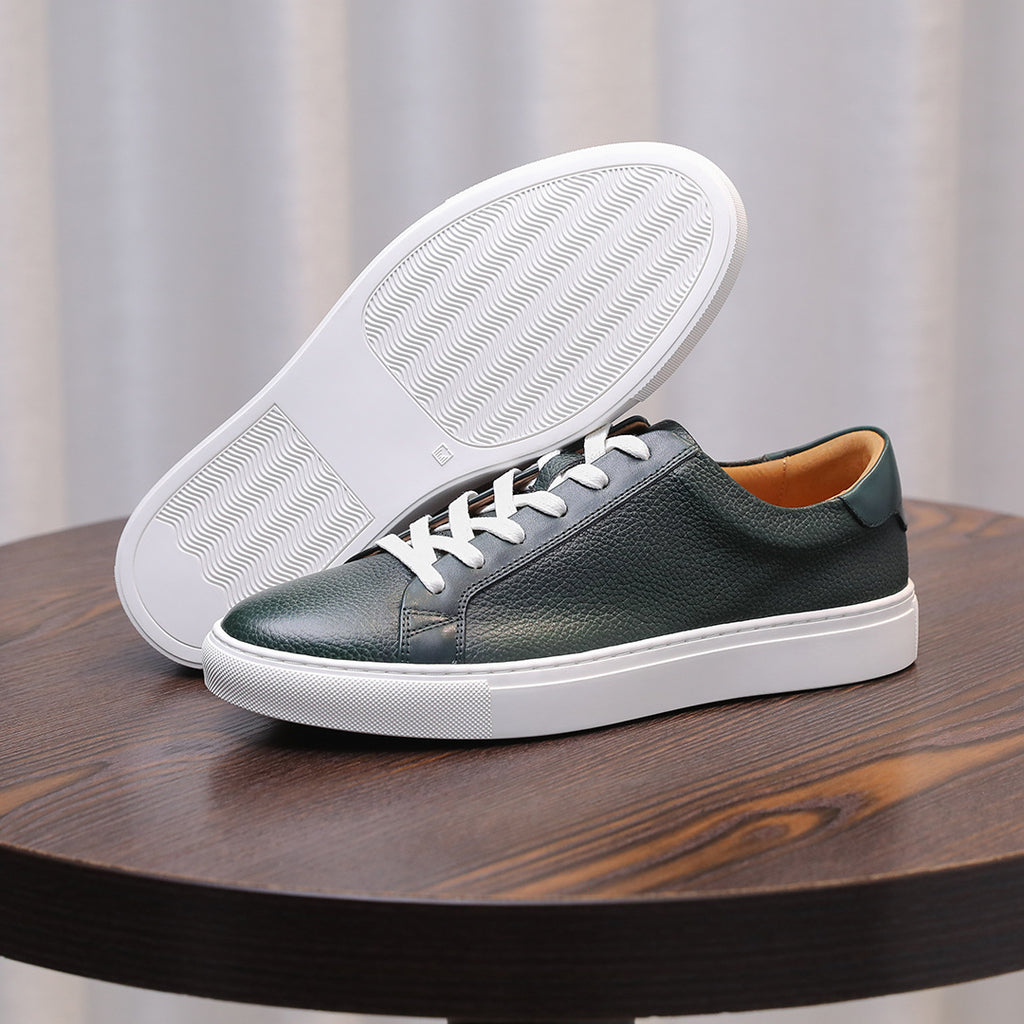 Men's genuine leather sneakers with visible outsole tread, green upper and white sole
