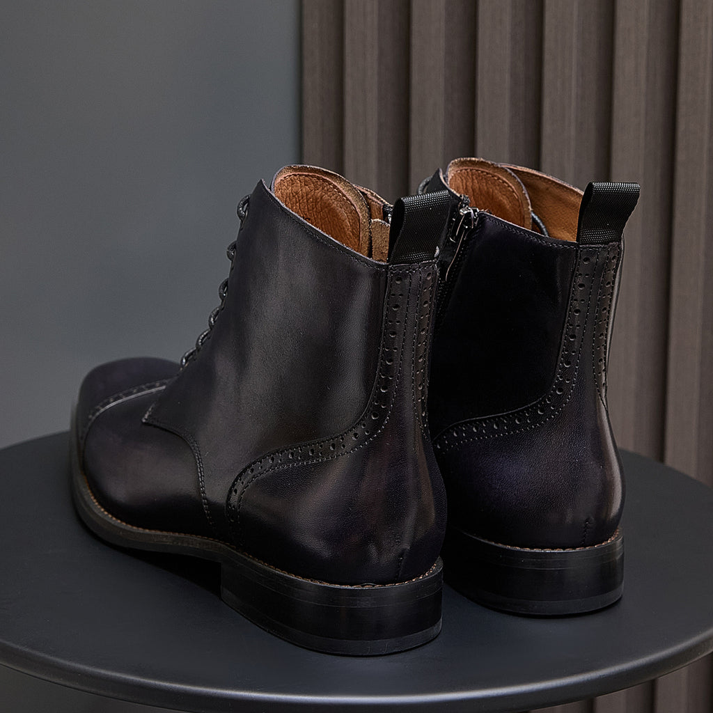 Men's dark leather side pull dress boots pair with stitched heel counter