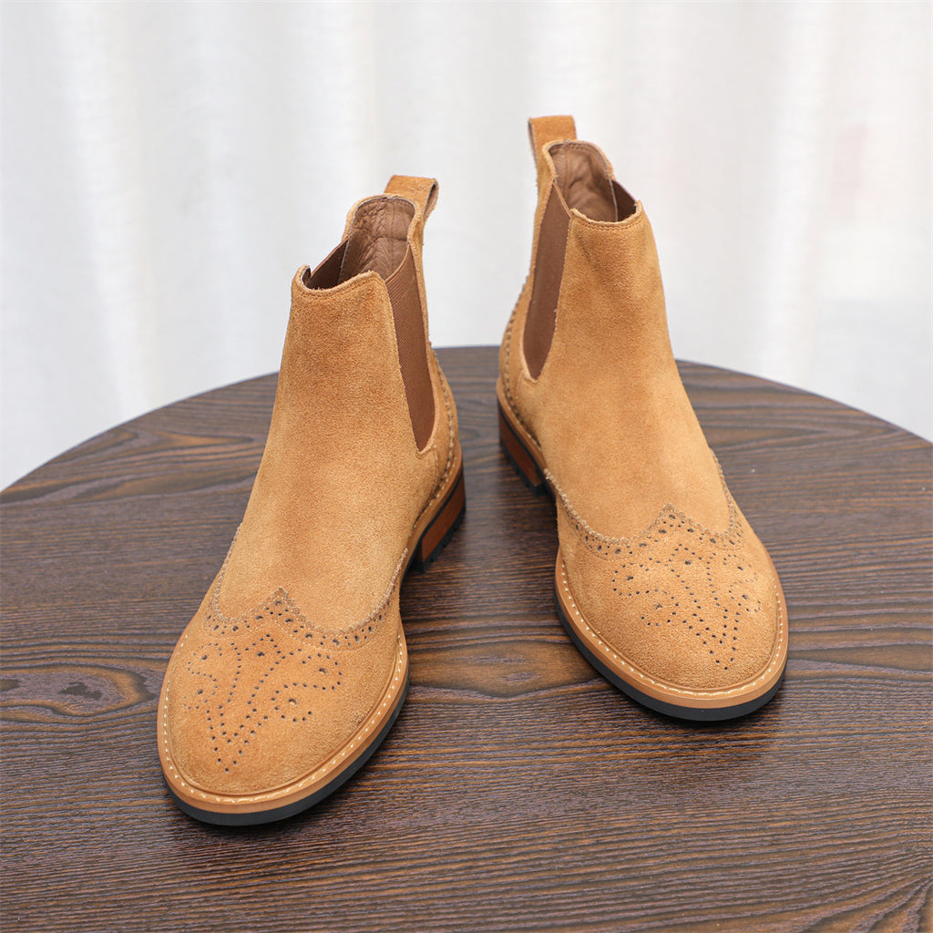 Pair of brown suede Chelsea dress boots with pointed toe and elastic ankle panels