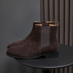 Men's pointed-toe suede Chelsea dress boots, dark brown, side profile on stand