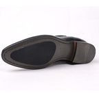 Side view of black Chelsea boot showing treaded sole and heel edge.