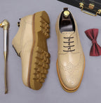 Men's leather derby dress shoes, white with perforated toe; view of tread sole