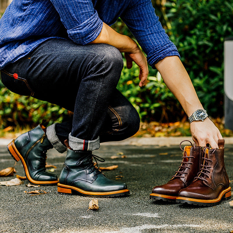 Men's dark green leather ankle dress boots with lace-up and side-zip, on person outdoors.