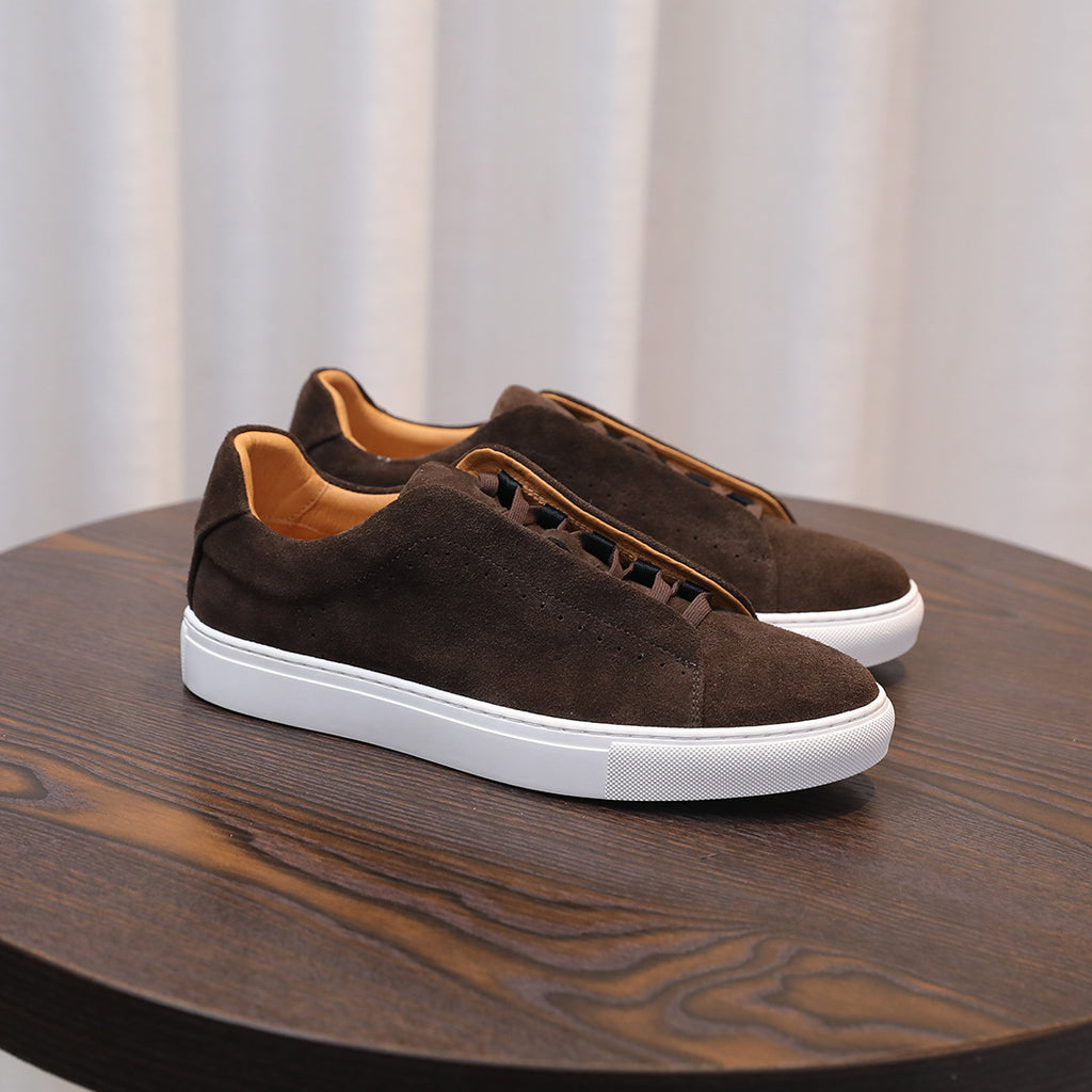 Men's brown suede leather sneakers with lace-up front and white rubber sidewall