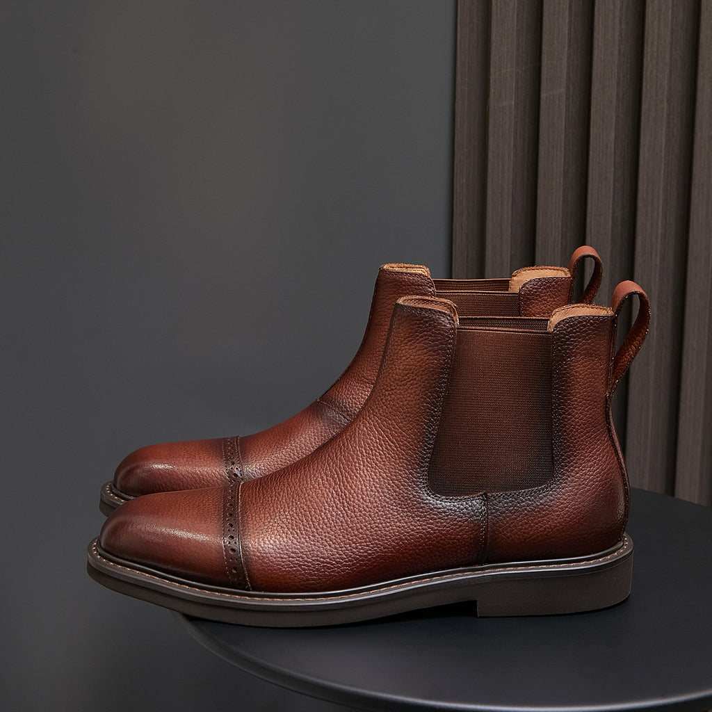 Dark brown Chelsea dress boots with pointed toe and side elastic panels