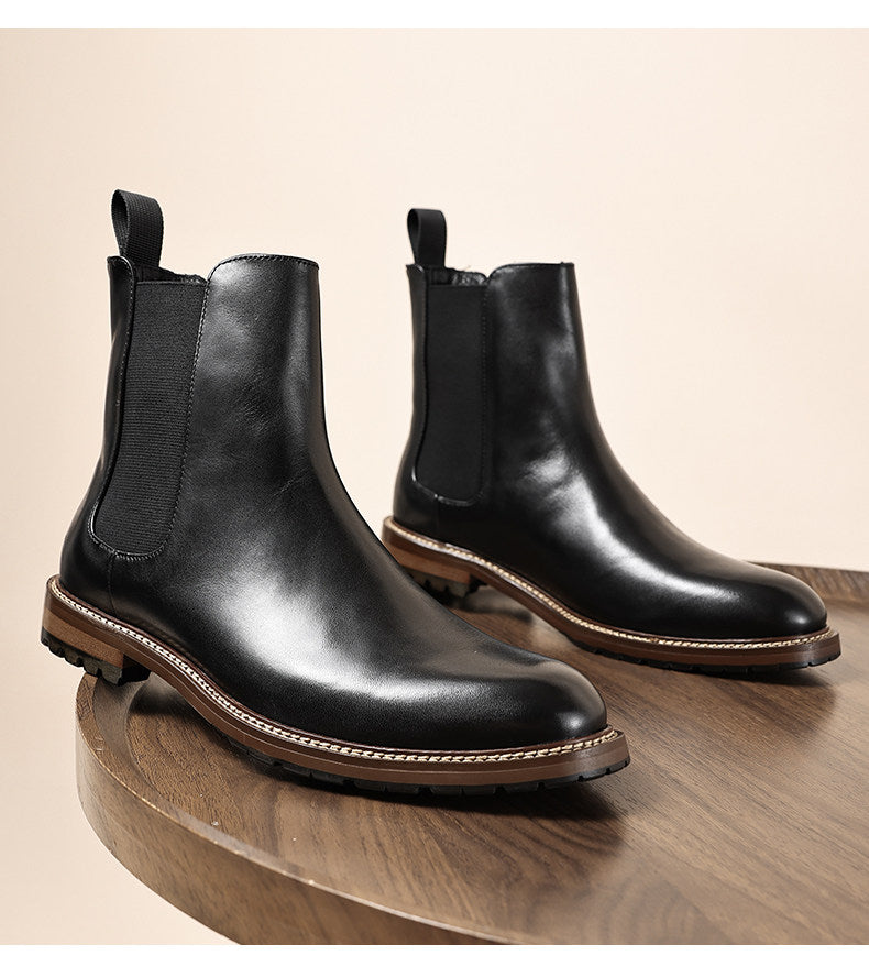 Black leather Chelsea dress boots with elastic gore and dark rubber sole