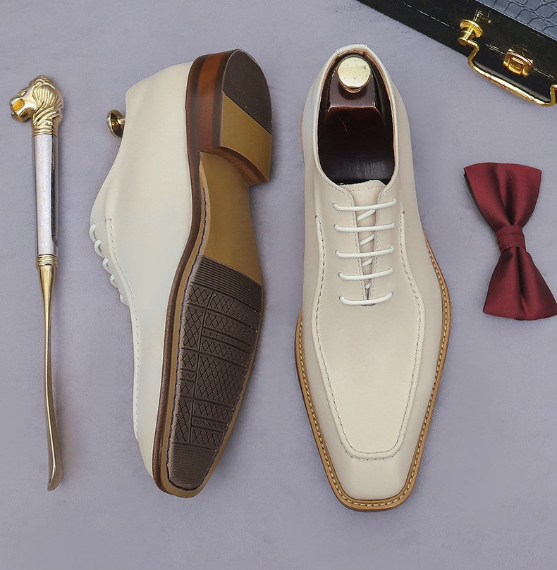 Beige and brown chunky lug-sole brogue Oxford shoes, showing outsole tread and lace-up