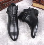 Black leather dress ankle boots with pointed toe and side buckle strap, low block heel.