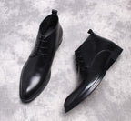Black leather lace-up dress boots, two-quarter view with low heel and pull tab