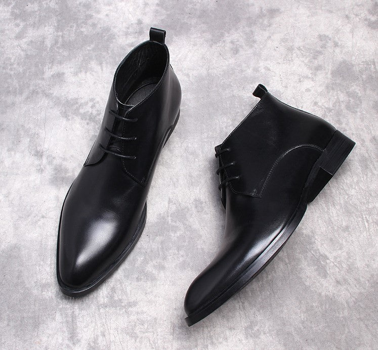 Black leather lace-up dress boots, two-quarter view with low heel and pull tab