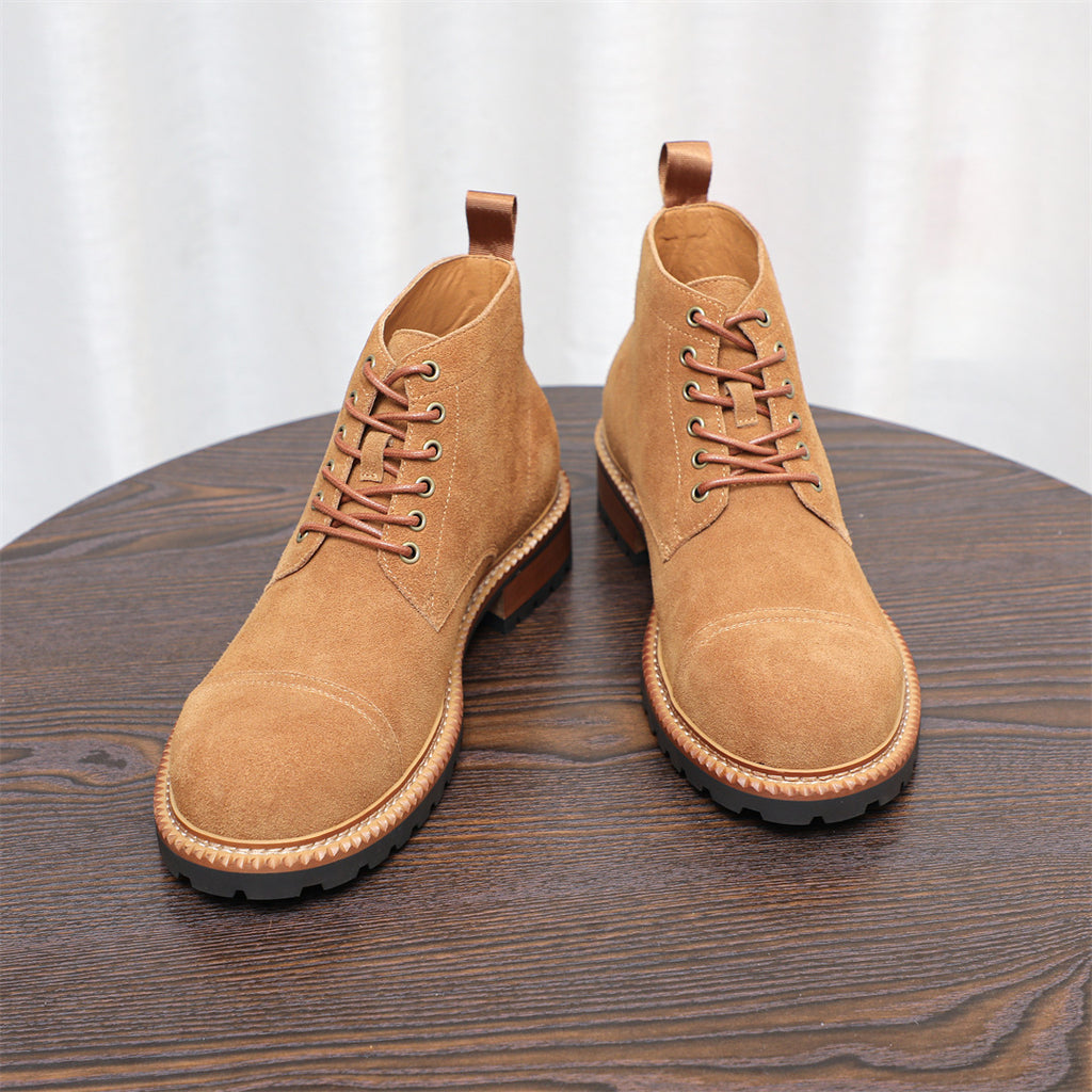 Men's tan lace-up chukka boots with plain toe and stitched welt trim