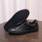 Men's black genuine leather sneaker, rubber outsole tread, lace-up low-top