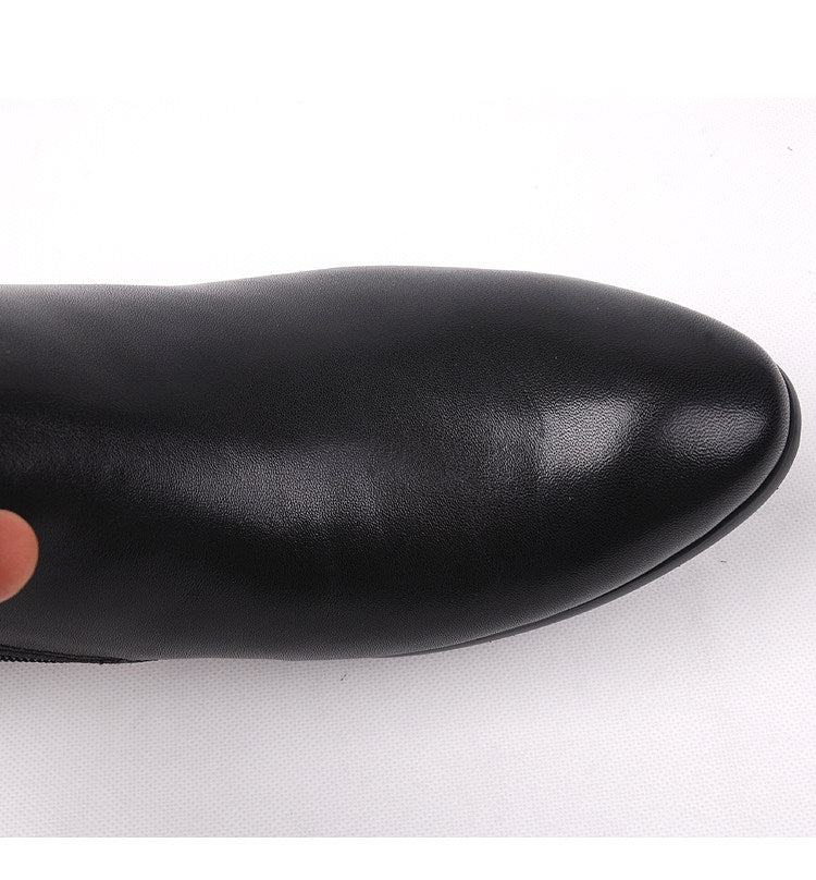 Black leather dress boot toe, smooth finish