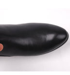 Black leather dress boot toe, smooth finish