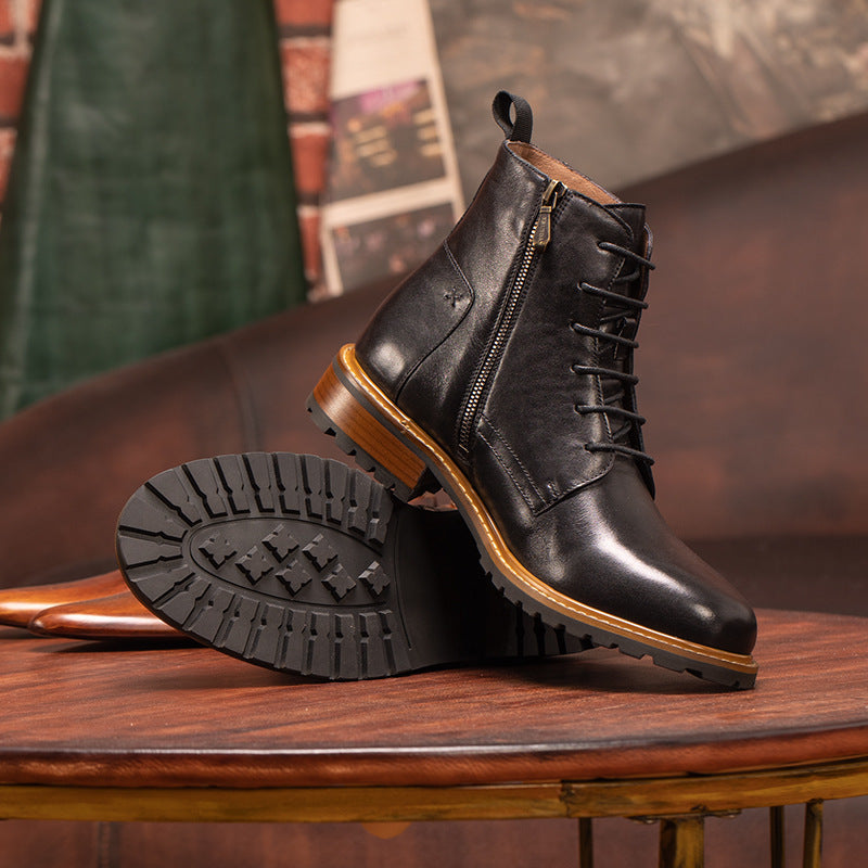 Black pointed-toe leather lace-up ankle boots with side-zip and rugged outsole tread.
