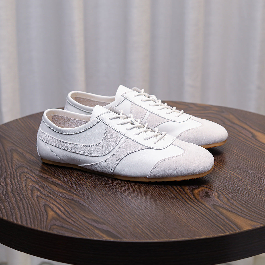 Men's white leather sneakers with side panel detailing, lace-up and gum sole