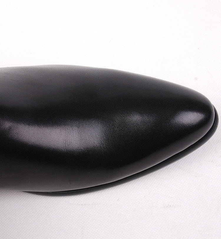 Black leather dress boot toe with smooth rounded cap