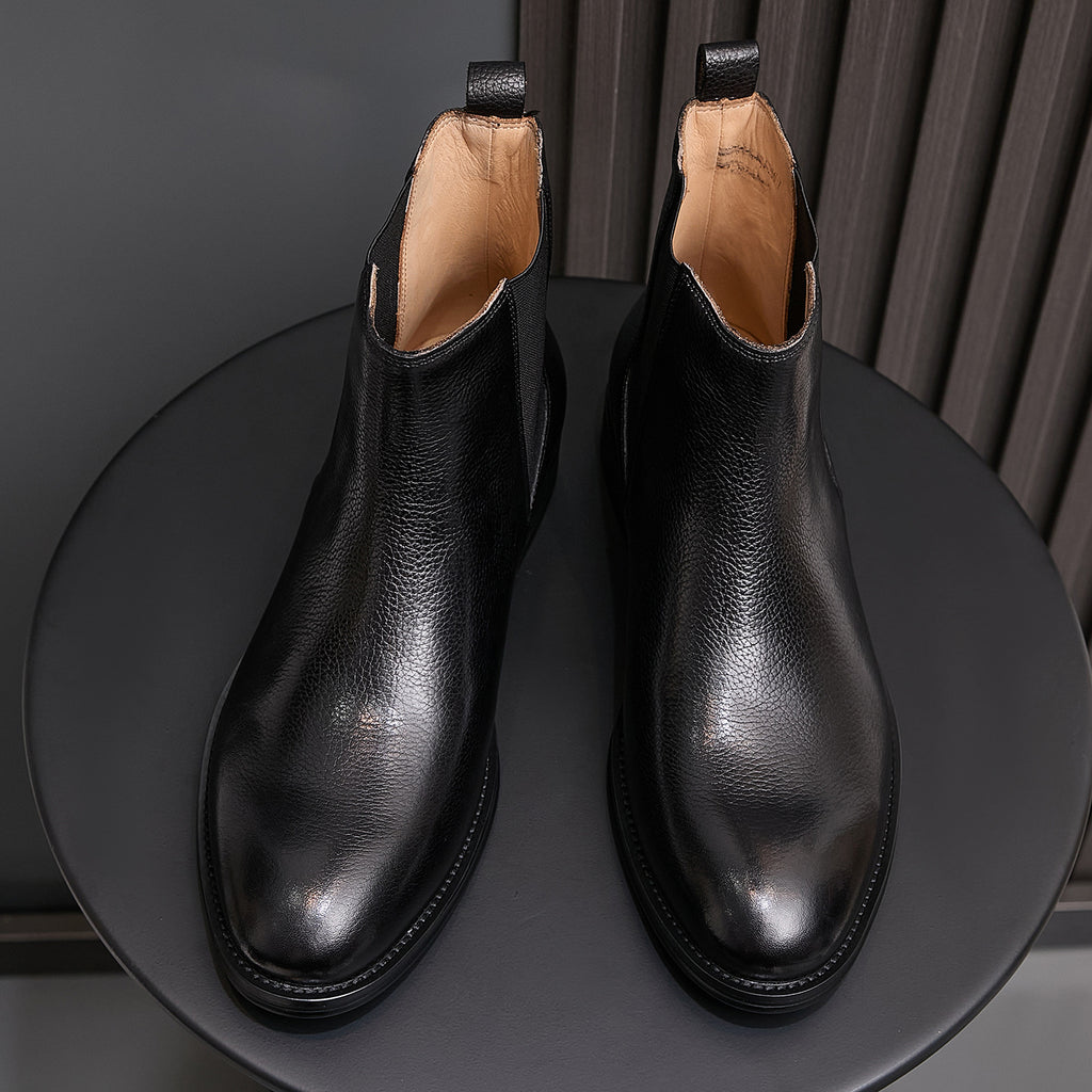 Pointed-toe Chelsea boots, black, paired view with elastic gore and lining