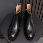Pointed-toe Chelsea boots, black, paired view with elastic gore and lining