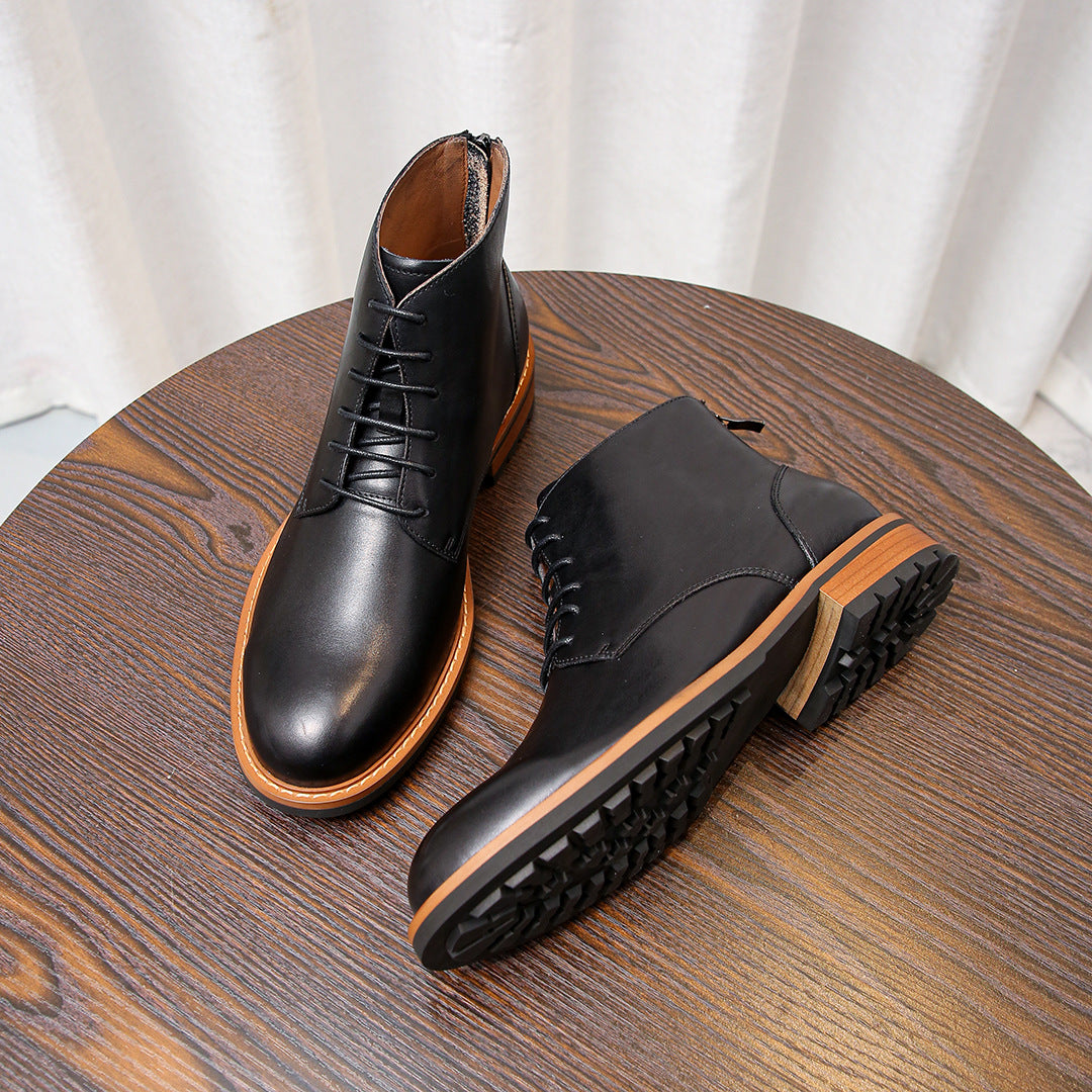 Black leather lace-up ankle boots with orange welt and textured rubber sole