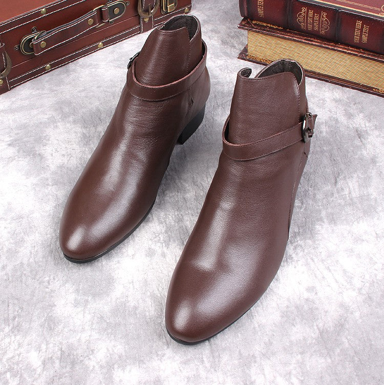 Brown leather pointed-toe ankle boots with side buckle strap and low block heel.