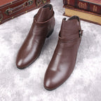 Brown leather pointed-toe ankle boots with side buckle strap and low block heel.