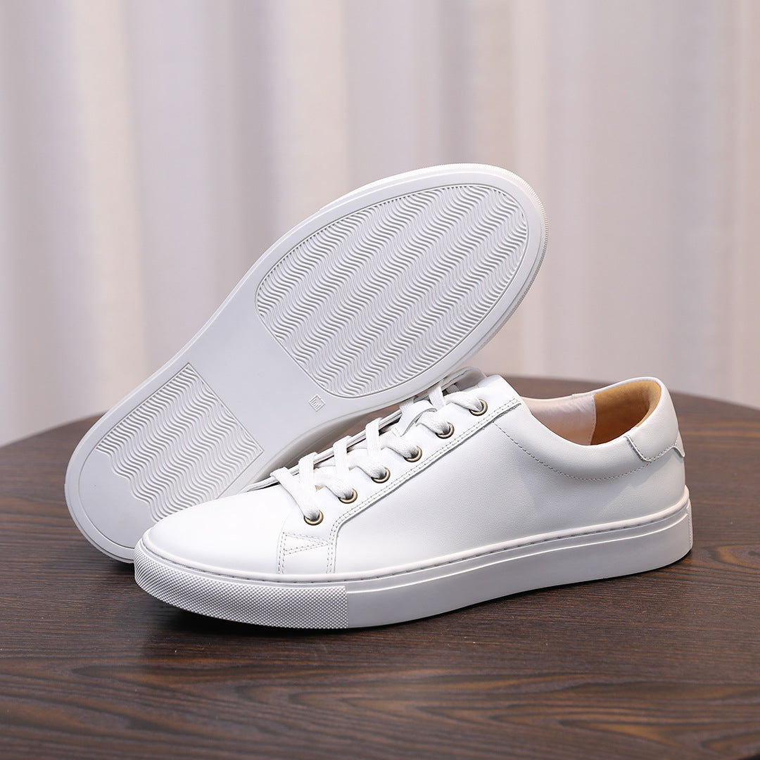 Men's white leather sneaker with lace-up upper and textured rubber outsole