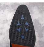 Black boot outsole with zigzag tread and three-point star traction pattern