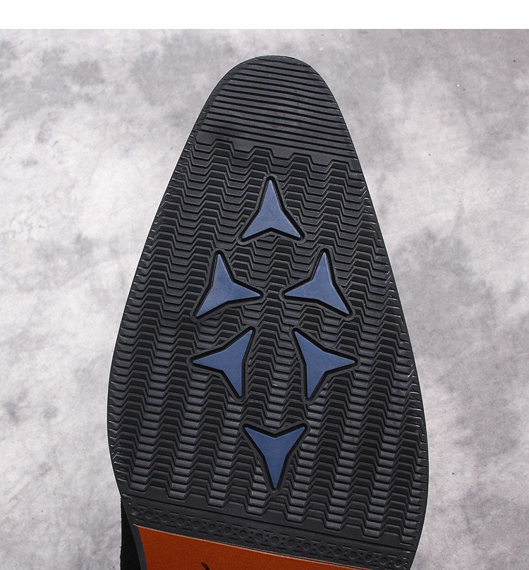 Black boot outsole with zigzag tread and three-point star traction pattern