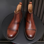 Brown Chelsea dress boots, pointed toe, elastic gore, and stitched trim