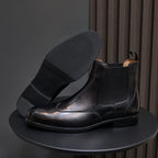 Men's pointed-toe black chelsea boots with elastic sides and black outsole