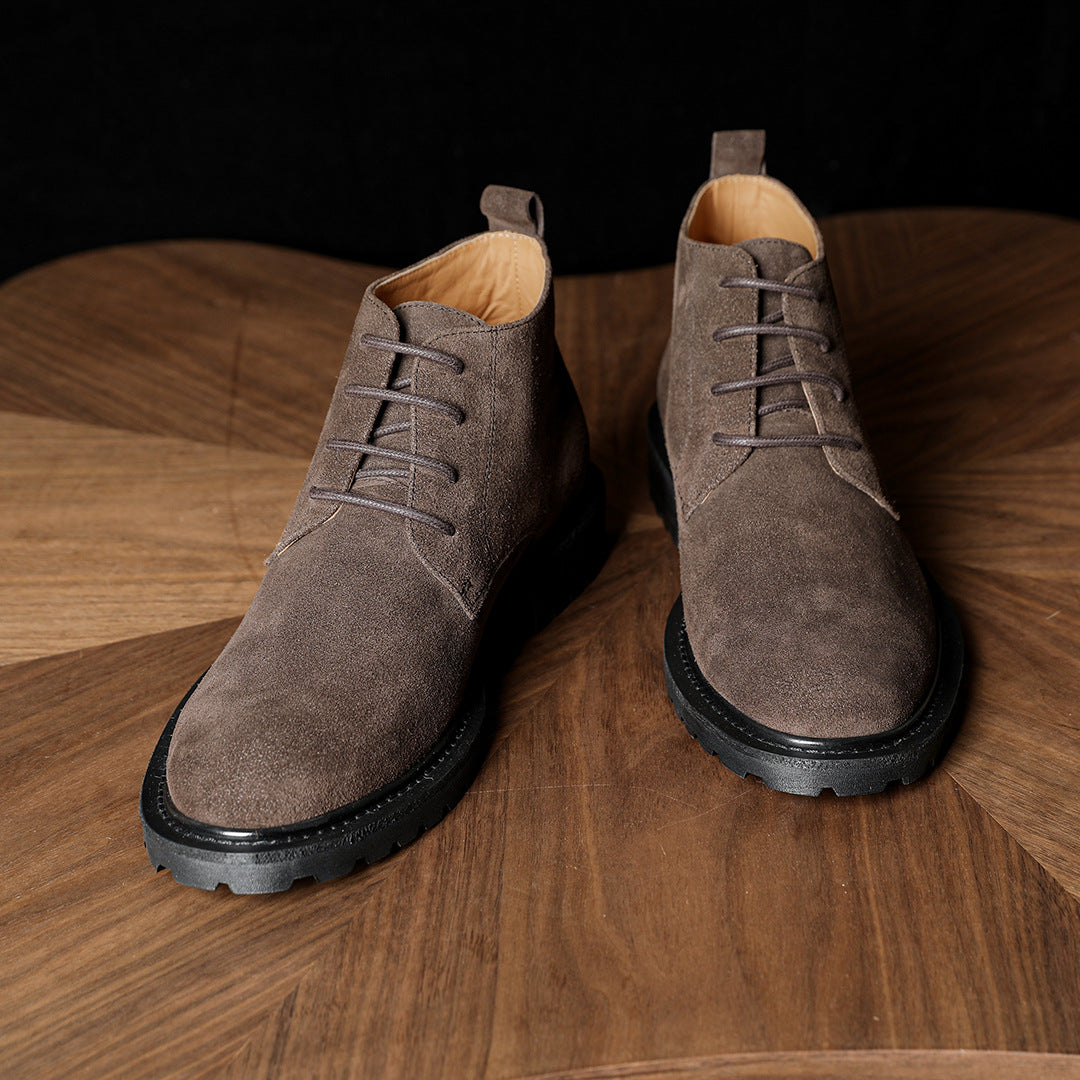 Men's dark brown suede lace-up chukka boots shown front view with black outsole