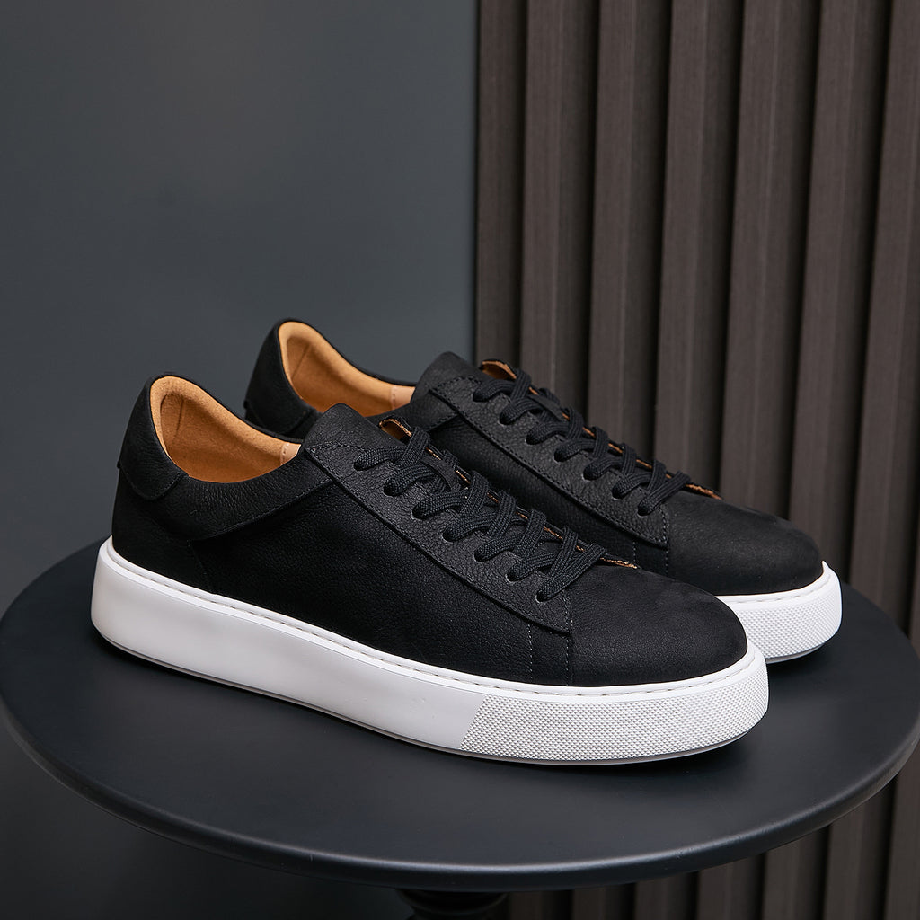 Men's genuine leather sneakers, black lace-up with white edge sole on display