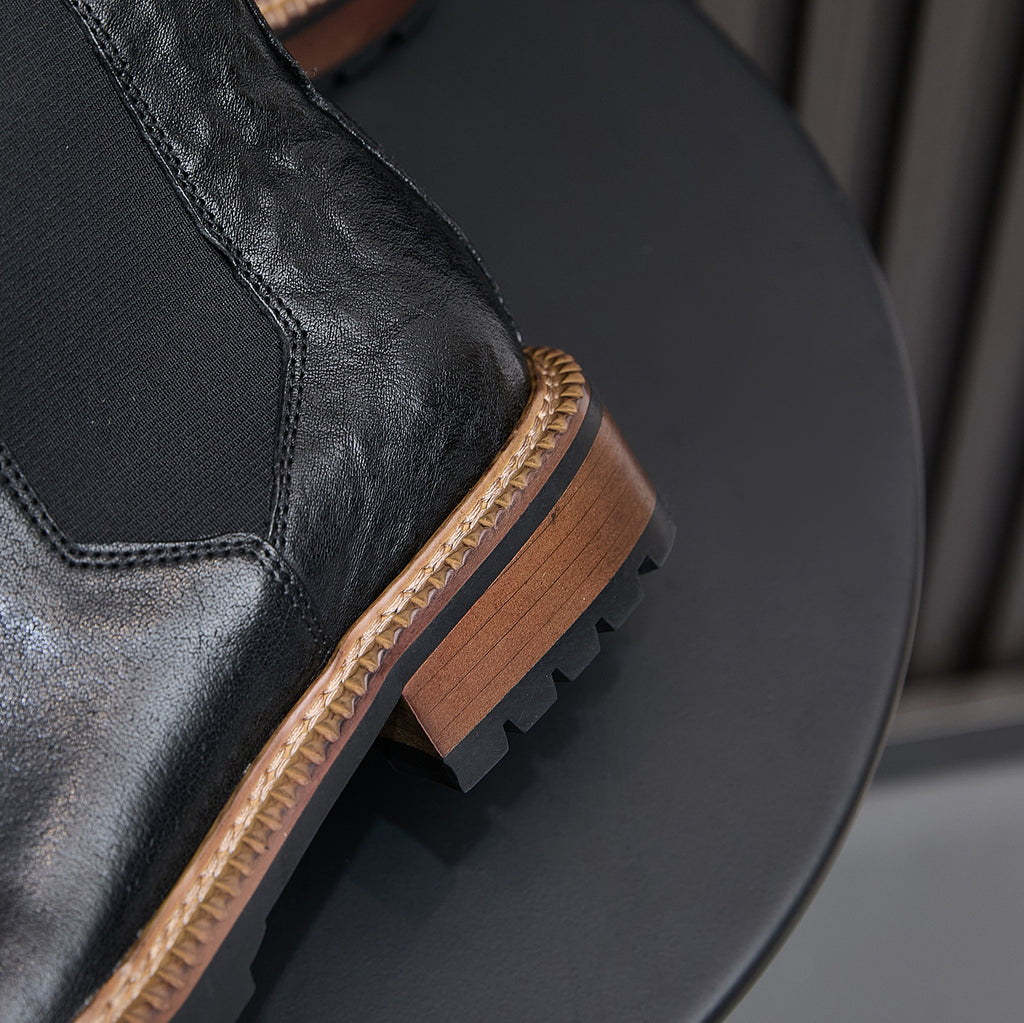 Men's pointed-toe suede Chelsea dress boots, dark brown, close-up of side panel and sole