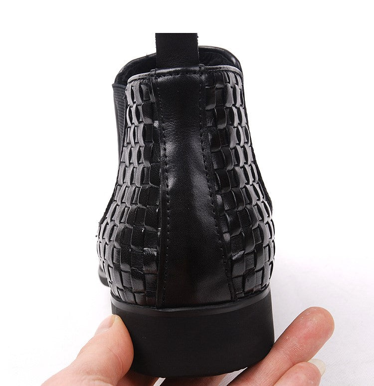 Black leather boot heel and back with woven trim and side zipper panel, thick sole